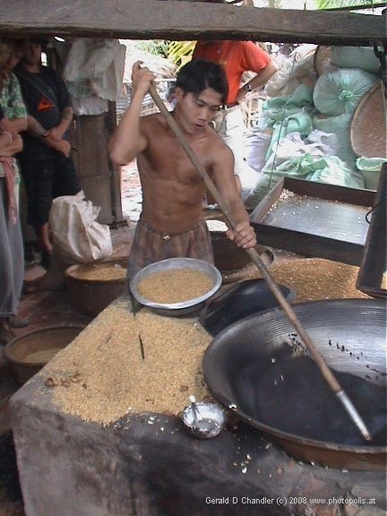 Man making popped rice