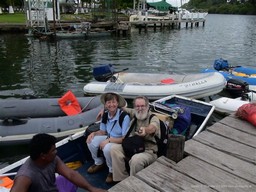Jan and Gerry in water taxi with luggage going to Lady Kis