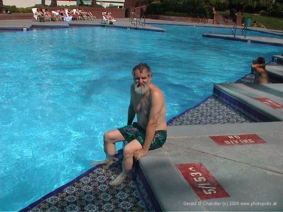 Gerry sitting on edge of Frontier Hotel pool